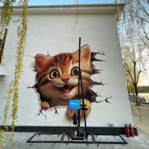 The wall printer is creating a 3D cat mural pattern on the wall.
